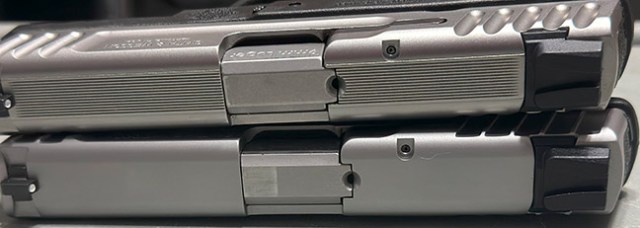 S&W SD9 2.0 9mm semi-auto handgun atop a SDVE pistol