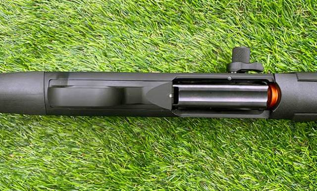 upside down Mossberg 940 Tactical Pro 12 gauge shotgun for easier loading