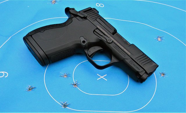 Smith and Wesson CSX 9mm handgun atop a blue silhouette target