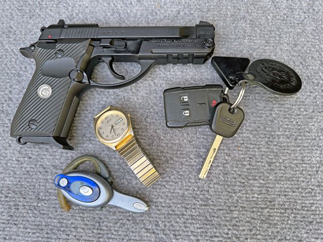Girsan MC 14T .380 handgun, right profile with pocket dump items