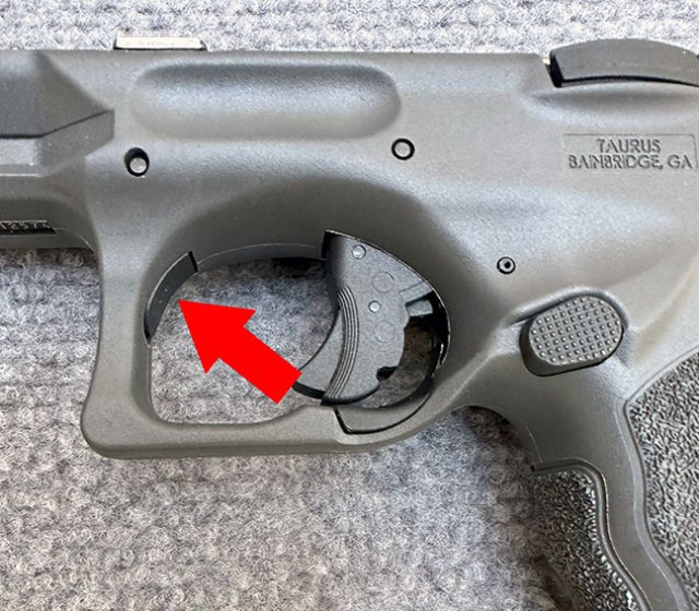 Takedown button on the Taurus TS9 9mm semi-automatic pistol