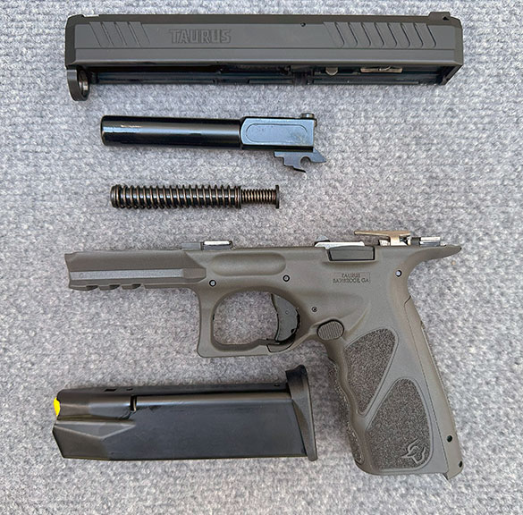 Field stripped Taurus TS9 9mm semi-auto handgun
