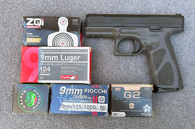 Taurus TS9 handgun with several boxes of ammunition from various manufacturers