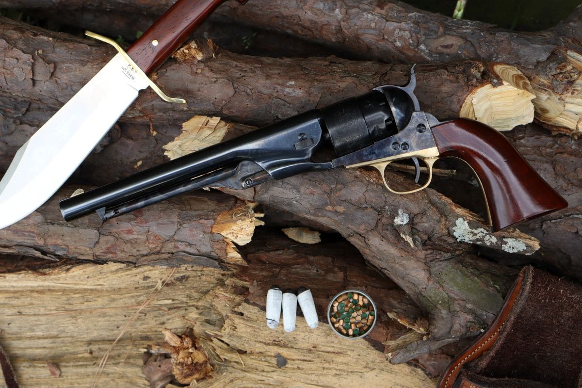 colt 1860 army revolver with holster, cartridges, caps, and knife