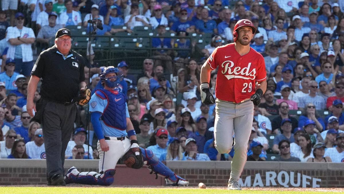 A Cincinnati Reds player hits a home run