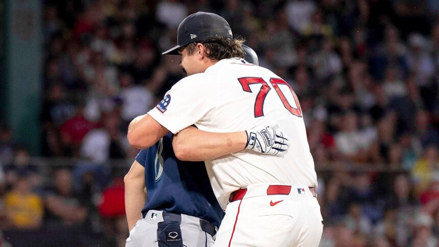 Red Sox starter records an out in hilarious fashion by hugging Mariners’ baserunner