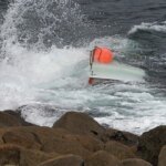 Teen boater found clinging to capsized vessel after 3 go missing; 2 bodies recovered