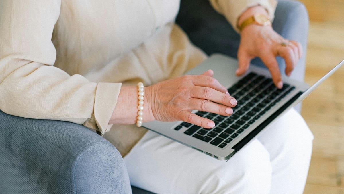 Woman typing on computer