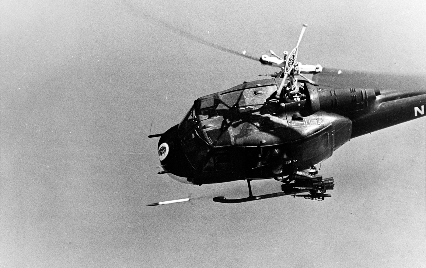 Bell UH-1 Helicopter Gunship of Helicopter Attack Light Squadron Three Detachment Three fires a 2.75-inch rocket in support of two river patrol boats