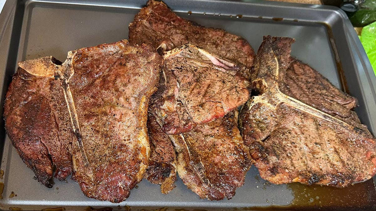 Screencaps reader CF in Kansas sends in T-bones off a charcoal grill.