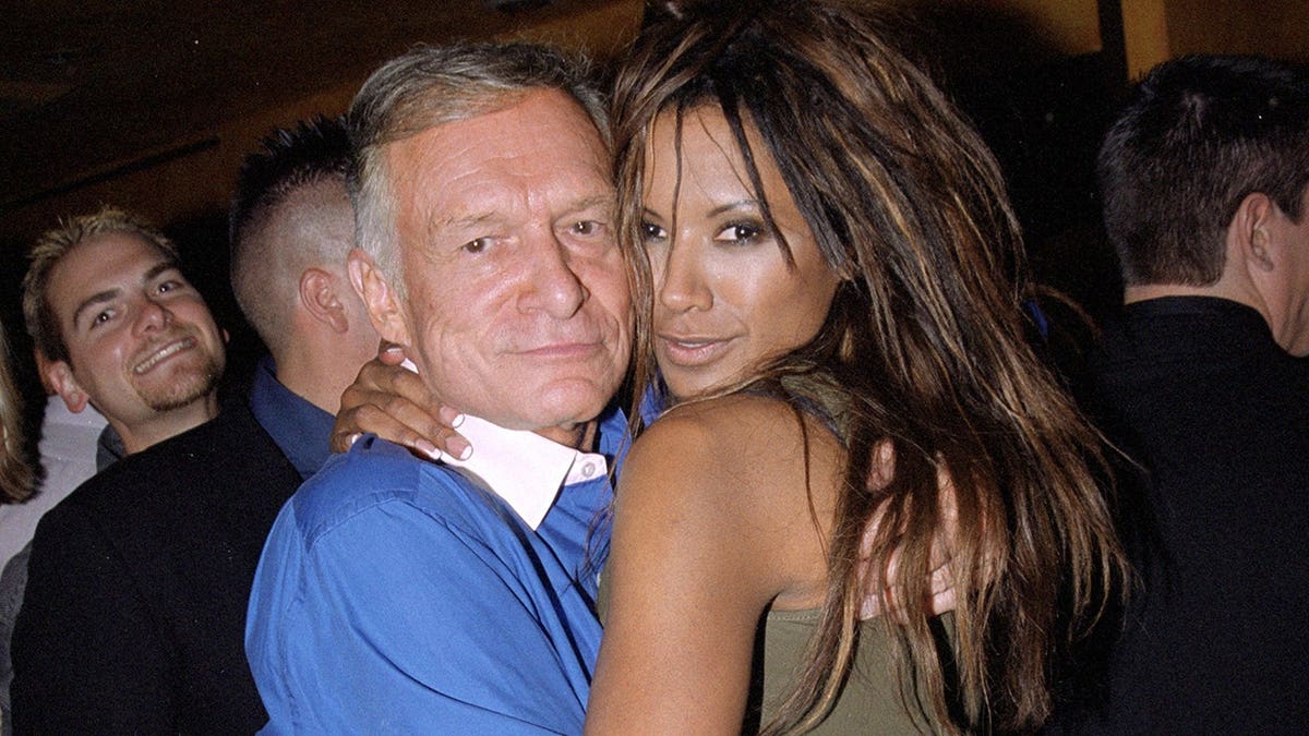 Hugh Hefner and Tracy Bingham pose outside the Barfly in Hollywood.