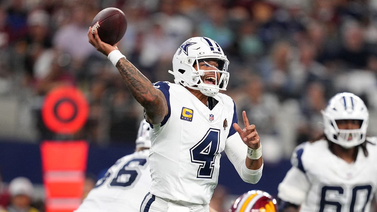 Dak Prescott passes against the Washington Commanders in Arlington, Texas.