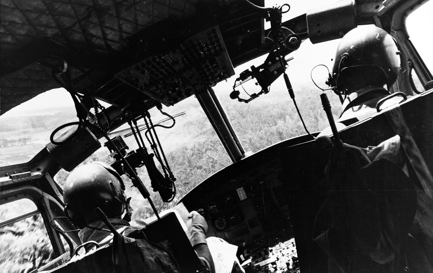 Navy Armed Gunship Helicopter banks in for a low reconnaissance run over a suspected Vietcong staging area in the Mekong Delta of South Vietnam