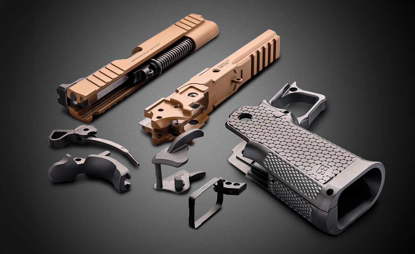 Prodigy slide assembly at top and serialized receiver in the center along with the Ed Brown Metal Grip Module at the bottom