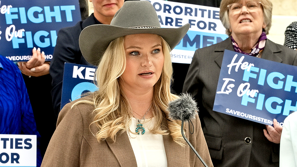 Allie Coghan stands outside federal appeals court in Denver.