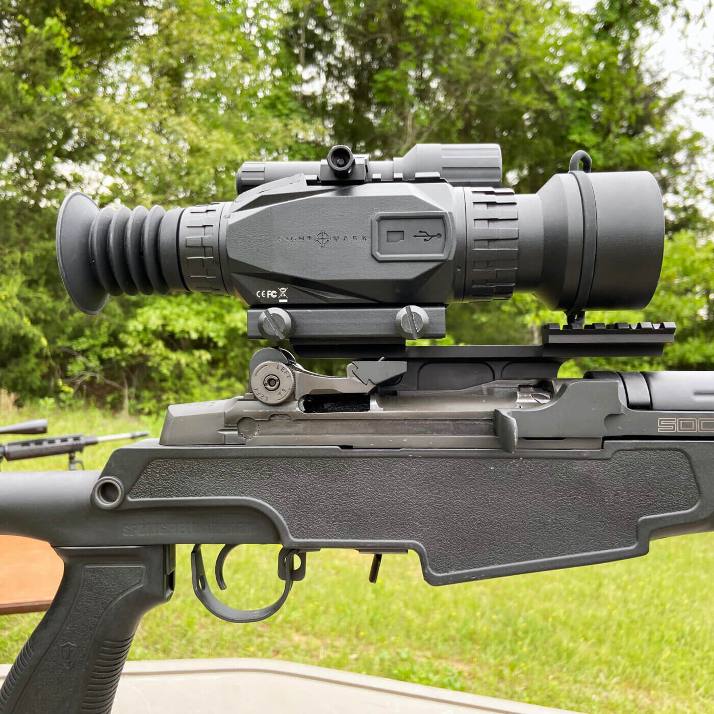 Sightmark Wraith HD day/night riflescope mounted on the M1A for hog hunting, ready to reach out and hit targets around the clock. The scope offers 4x optical and 8x digital zoom plus a built-in camera for recording hunts. It sits on a Springfield 4th Generation Aluminum Scope Mount for a solid, repeatable setup.