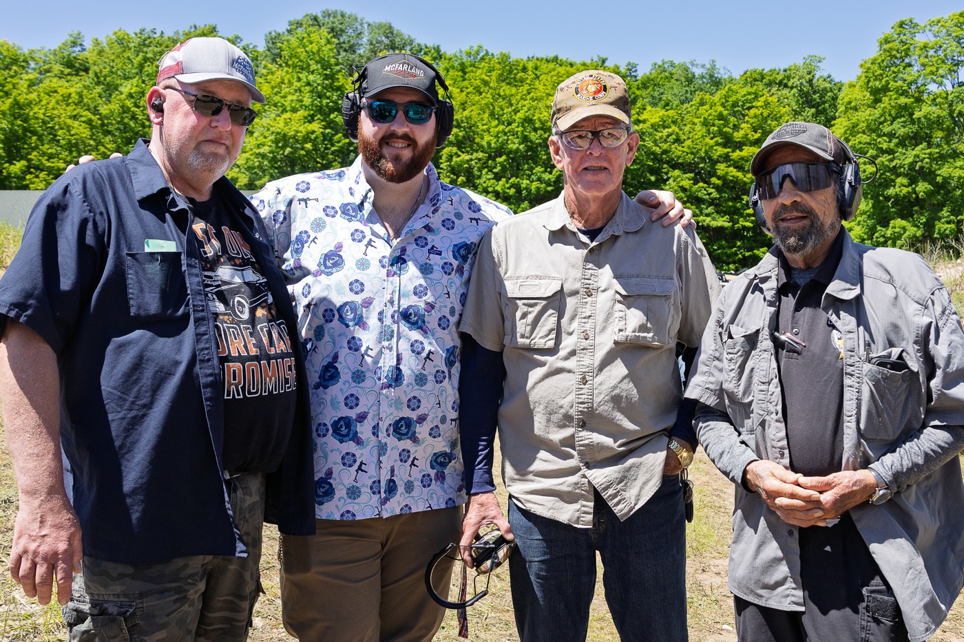 author Massad Ayoob poses with Michell family at the final Pin Shoot