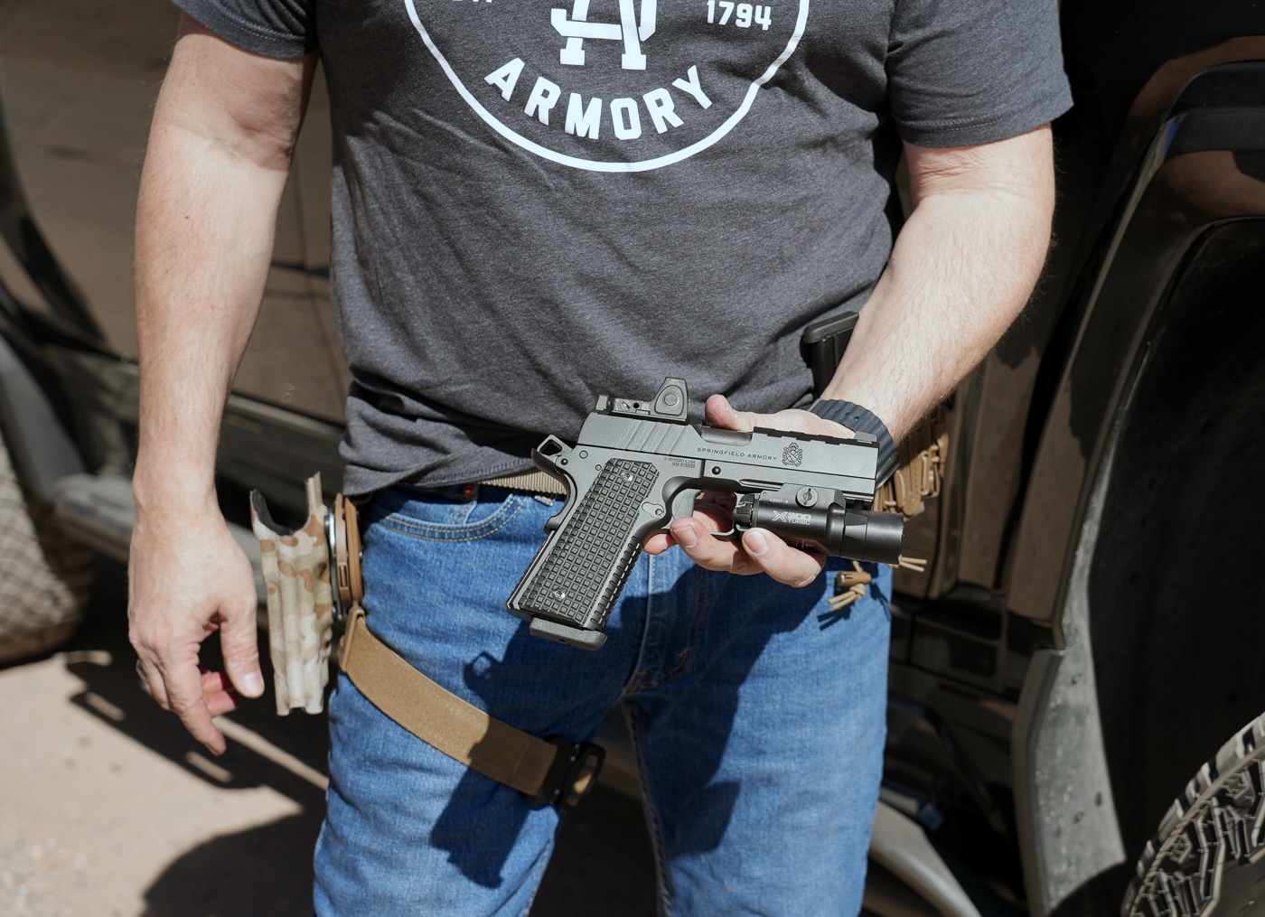 author holding the 1911 Emissary AOS 9mm
