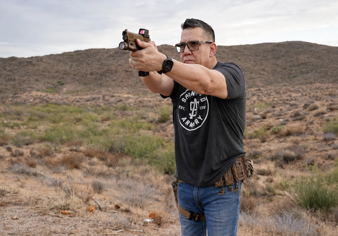 author shooting the Prodigy pistol using red dot sight