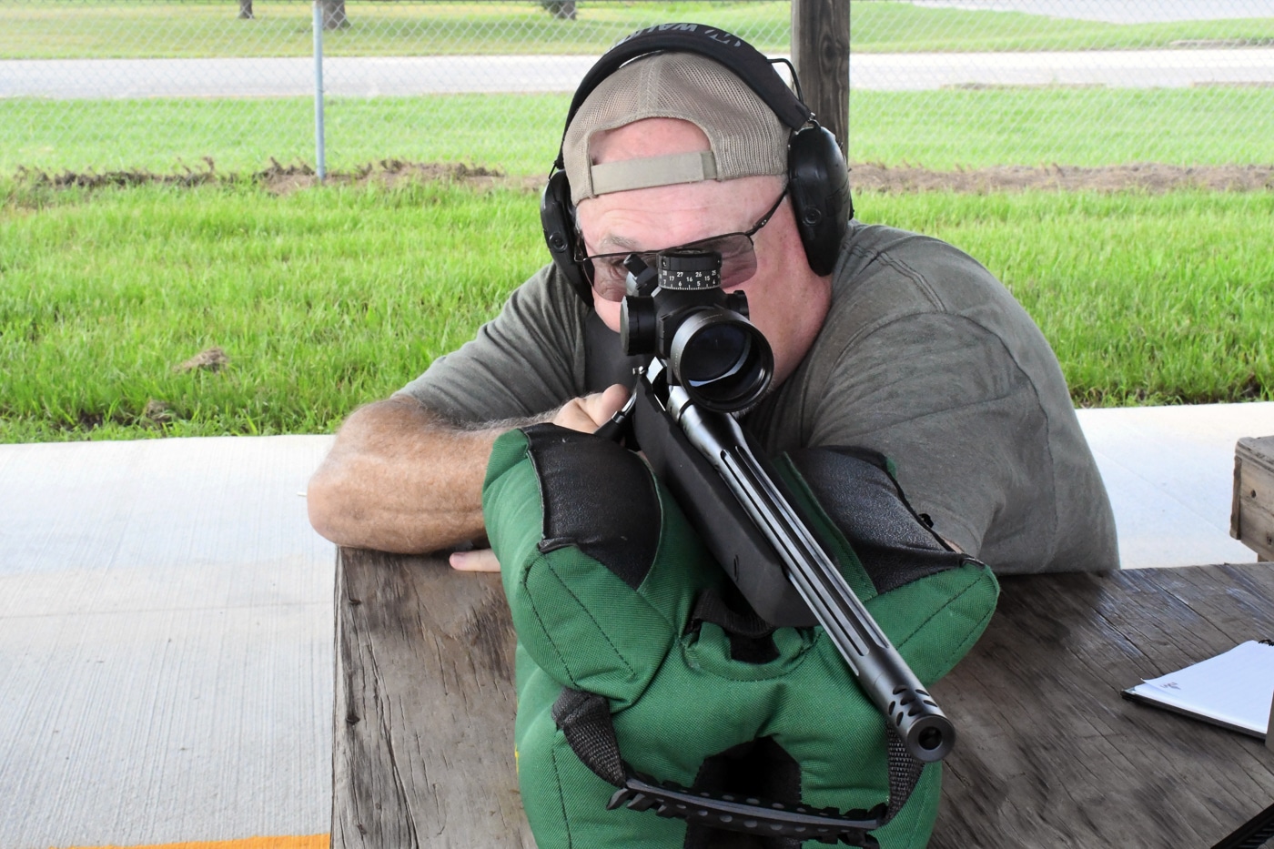 author shooting the Springfield Armory Model 2020 Waypoint with SG-100 Cerakote finish from a bench for accuracy testing