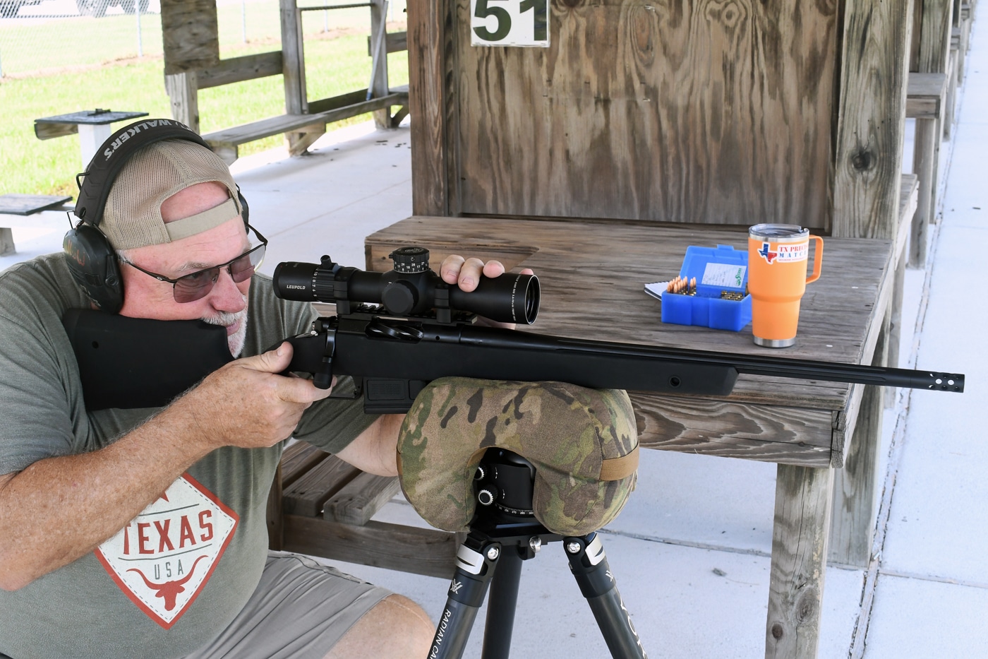 author shooting the Springfield Armory Model 2020 Waypoint with SG-100 Cerakote finish from a tripod for accuracy testing at an outdoor range