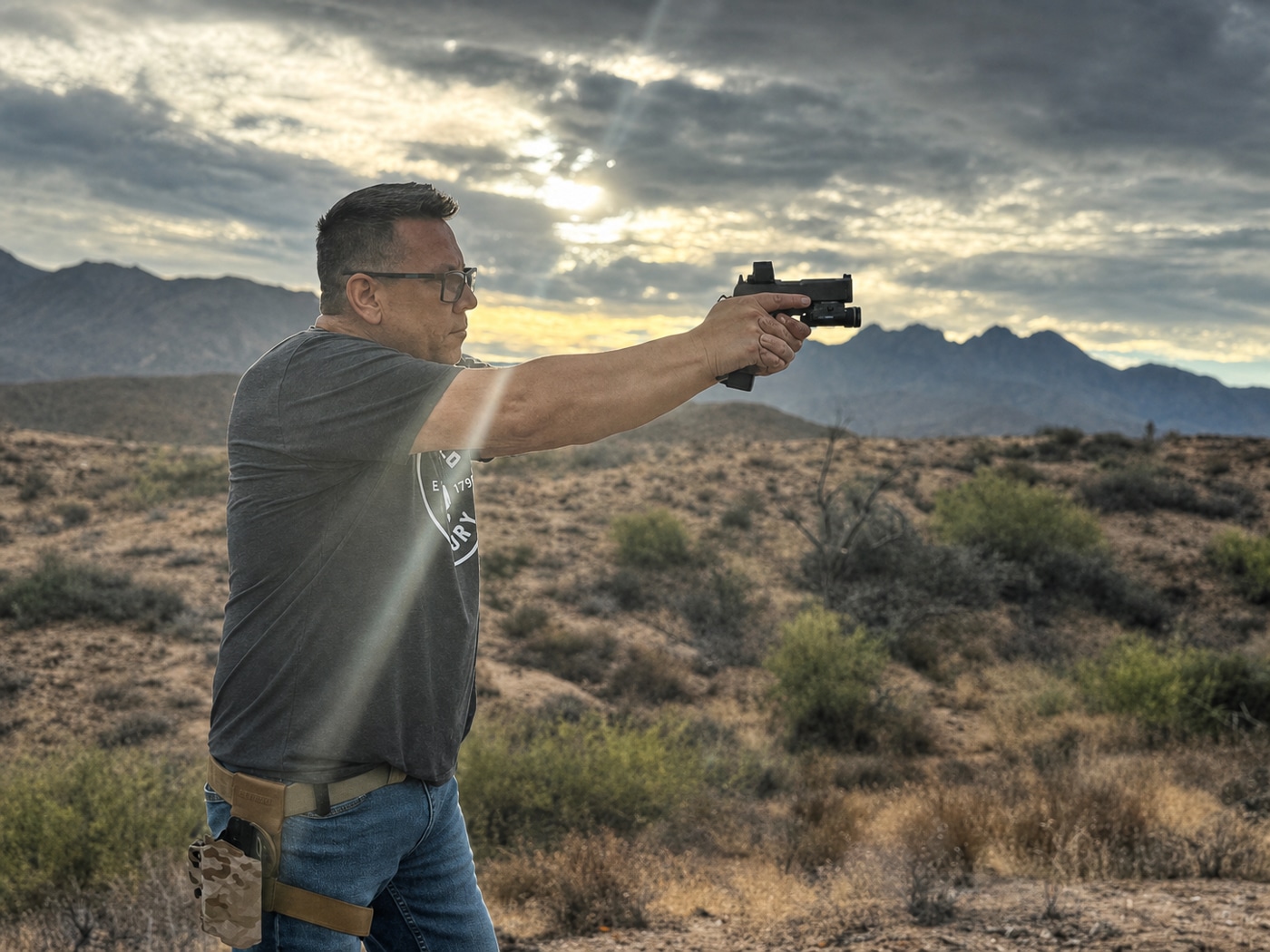 author shooting the Springfield Prodigy pistol on an outdoor range