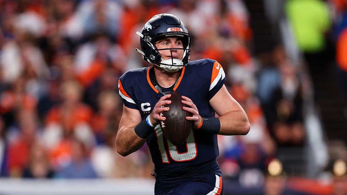 Bo Nix #10 looks to pass during a game at Empower Field at Mile High.