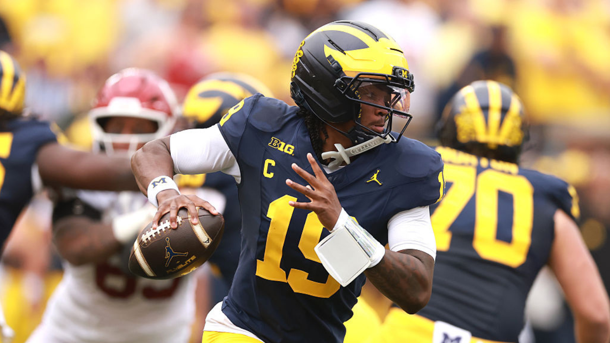 Bryce Underwood #19 of Michigan looks to throw a pass against Oklahoma.