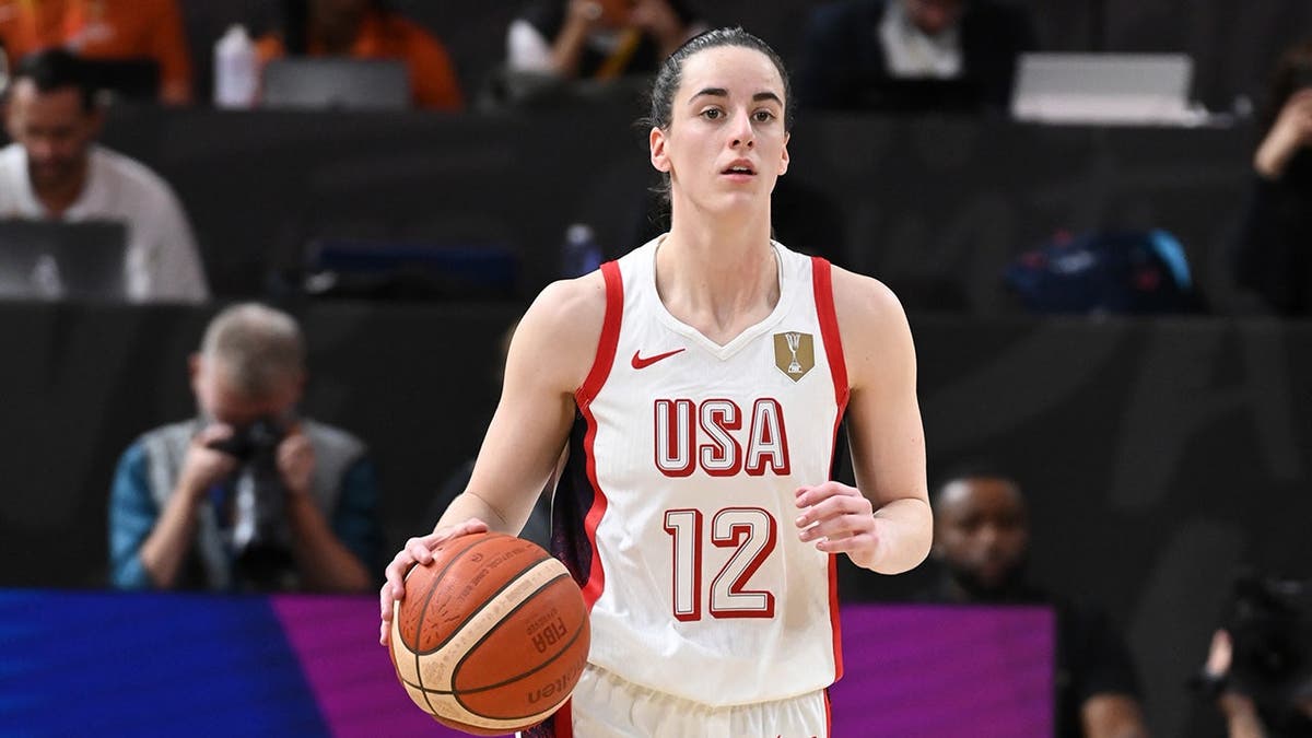 Caitlin Clark dribbles the ball during a Women's Basketball World Cup game in Berlin.