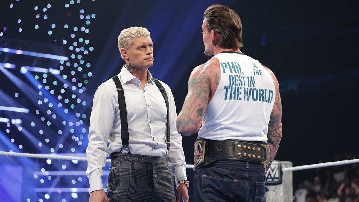 Cody Rhodes and CM Punk stand in the ring during SmackDown.