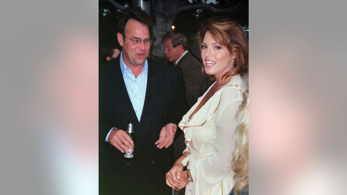 Dan Aykroyd stands with Sandra Taylor, circa 1992.