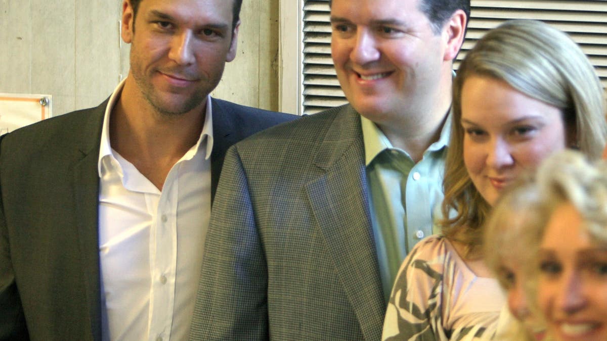 Dane Cook stands with his half brother Darryl McCauley and family members at Boston City Hall.
