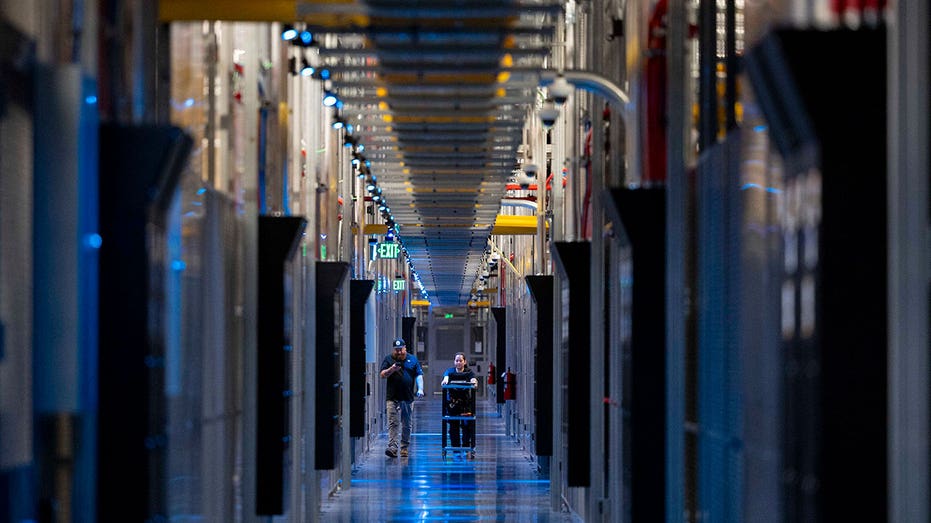 ASHBURN, VA - MAY 9: People walk through the hallways at Equinix Data Center in Ashburn, Virginia, on May 9, 2024. (Amanda Andrade-Rhoades for The Washington Post via Getty Images)