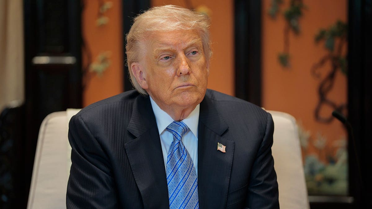 U.S. President Donald Trump looking on during a meeting in Beijing