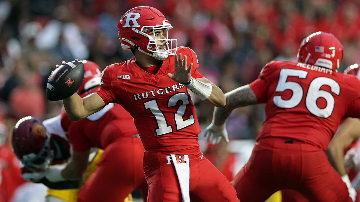 Rutgers quarterback Dylan Lonergan passes during a college football game.