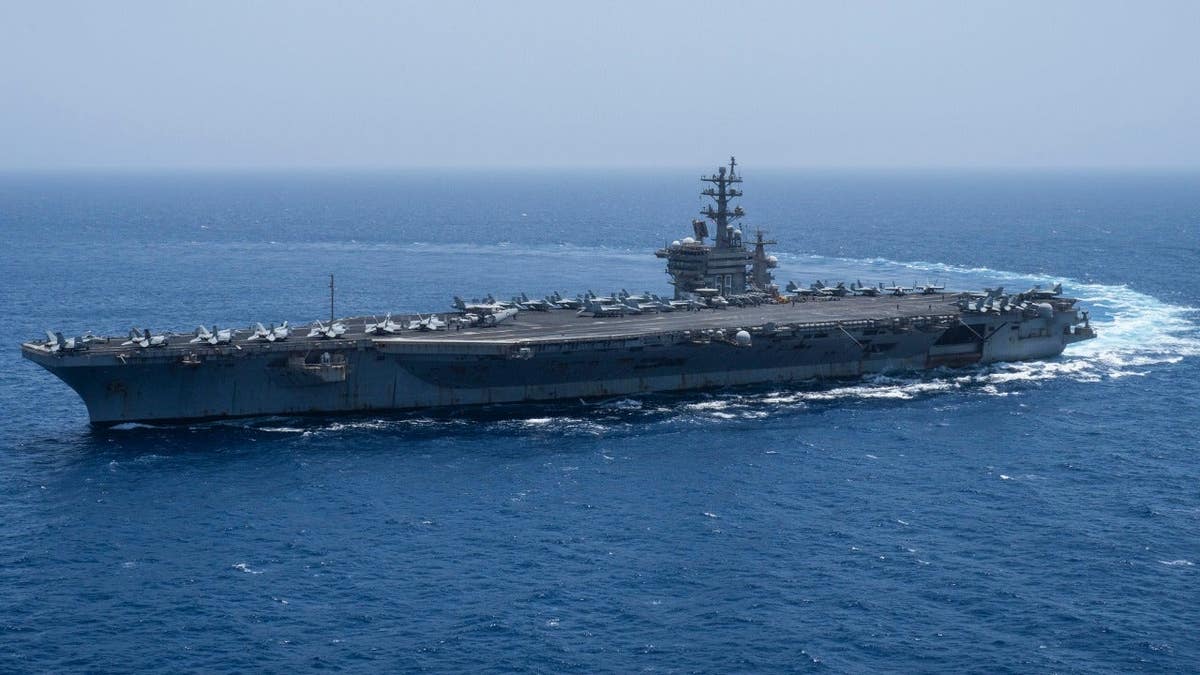 The USS aircraft carrier Dwight D. Eisenhower sails in the Red Sea