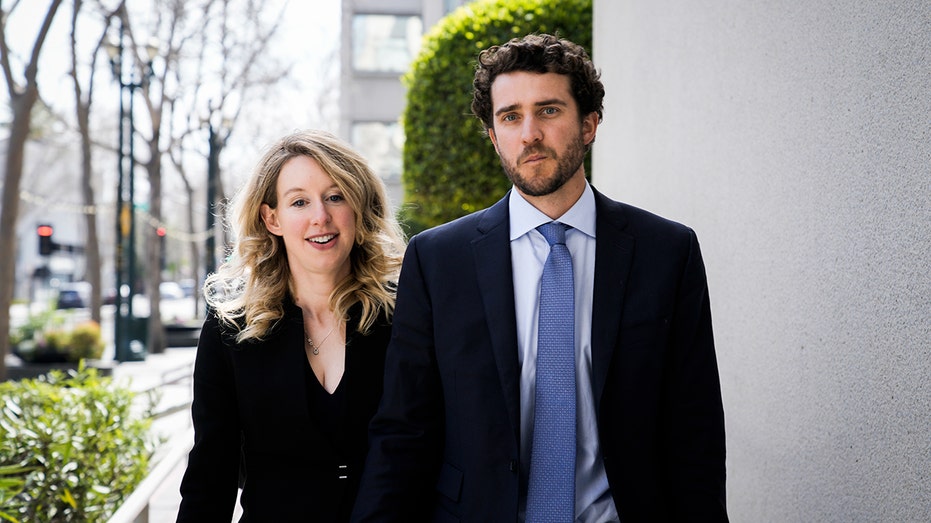 Former Theranos CEO Elizabeth Holmes alongside her boyfriend Billy Evans
