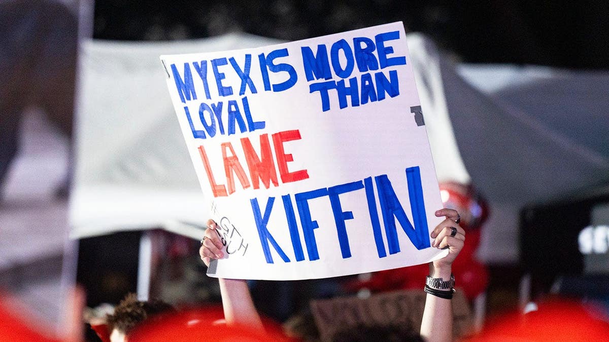 A sign is seen at ESPN College GameDay in The Grove in Oxford, Miss.