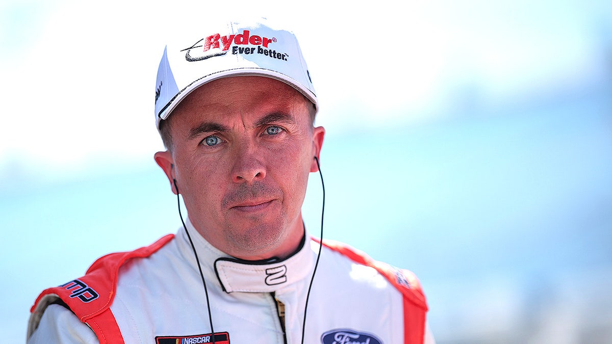 Frankie Muniz at Nascar speedway, wearing racing suit
