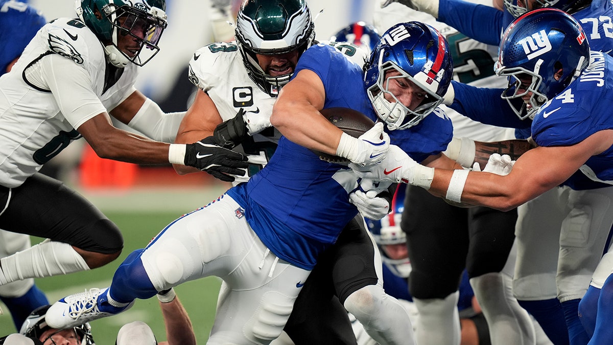 Cam Skattebo scores a touchdown