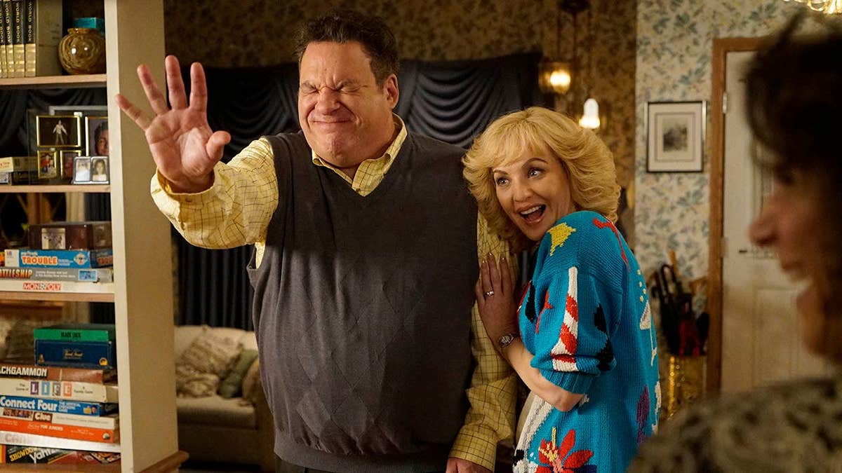Jeff Garlin and Wendi McLendon-Covey stand together in a scene from The Goldbergs.