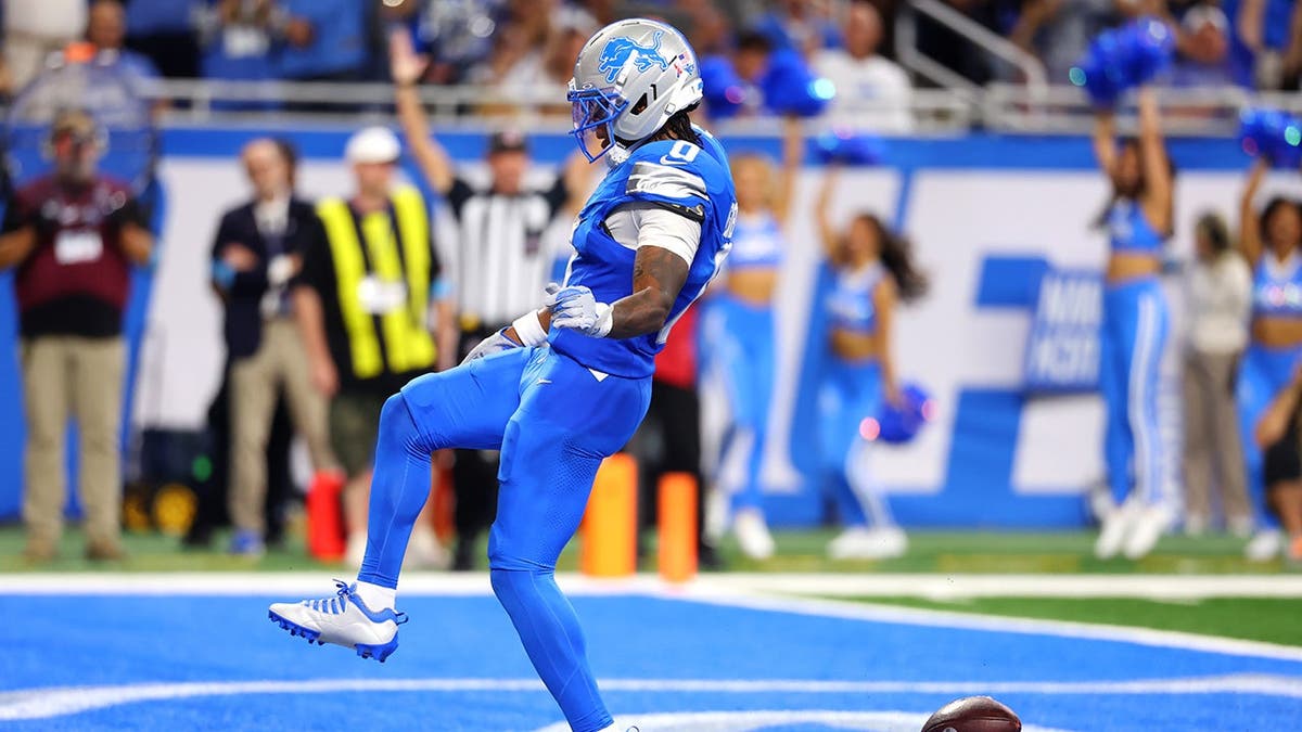 Jahmyr Gibbs celebrates after scoring a touchdown against the New Orleans Saints.