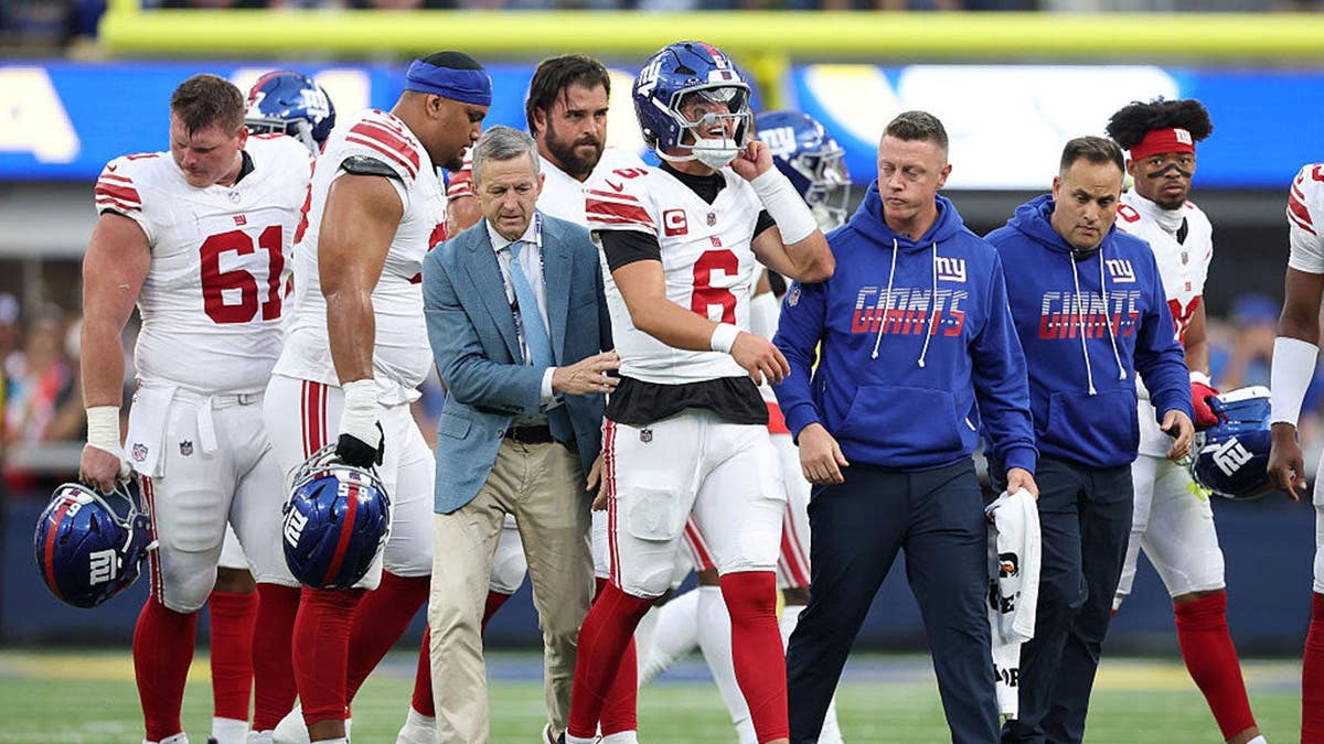 Jaxson Dart of the New York Giants walks off the field during a game against the Los Angeles Rams.