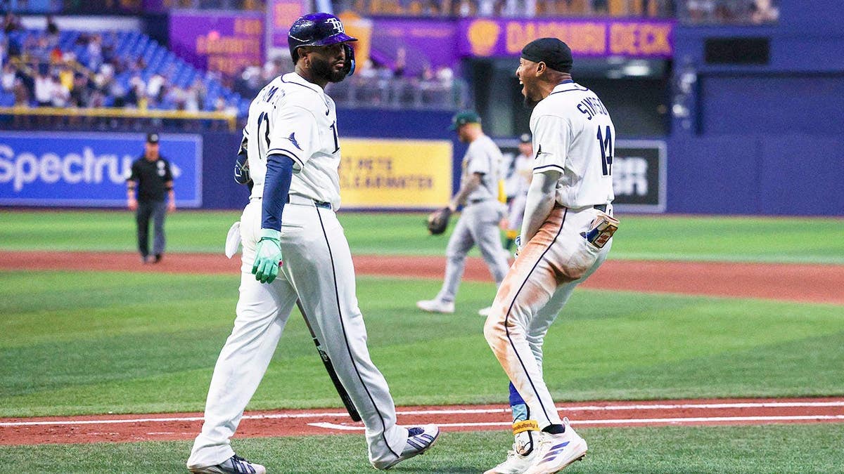 Junior Caminero reacts after a walk-off home run at Tropicana Field.