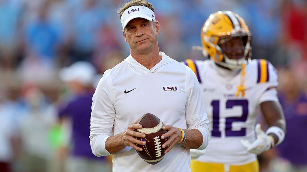 Lane Kiffin walks onto the field before a game in Oxford, Mississippi.