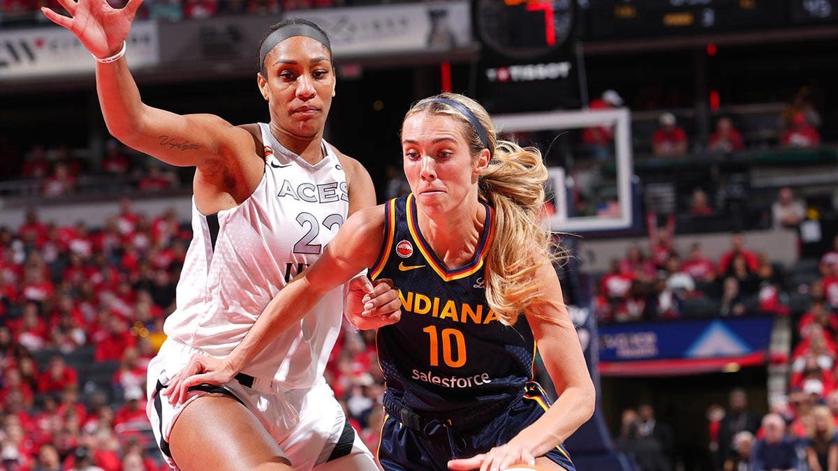 Lexie Hull drives to the basket as A'ja Wilson defends during a WNBA playoff game.