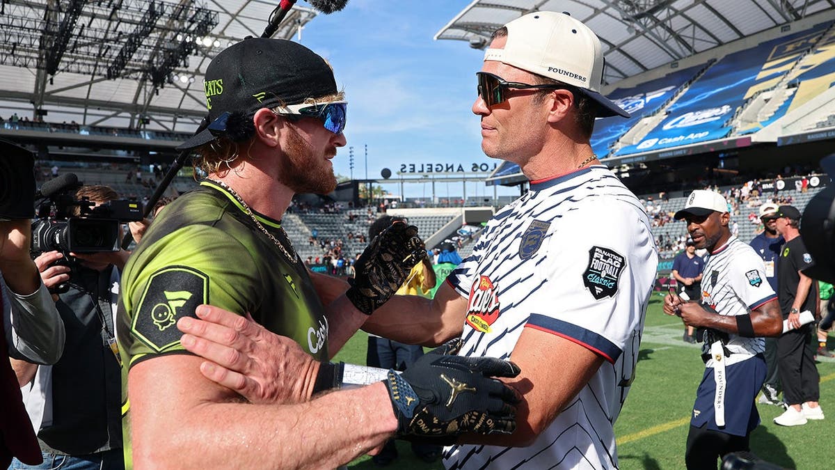 Logan Paul and Tom Brady speak during the Fanatics Flag Football Classic at BMO Stadium.