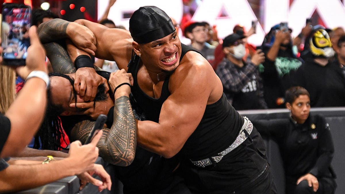 Lucien Price wrestles Jimmy Uso during Monday Night Raw at Fiserv Forum.