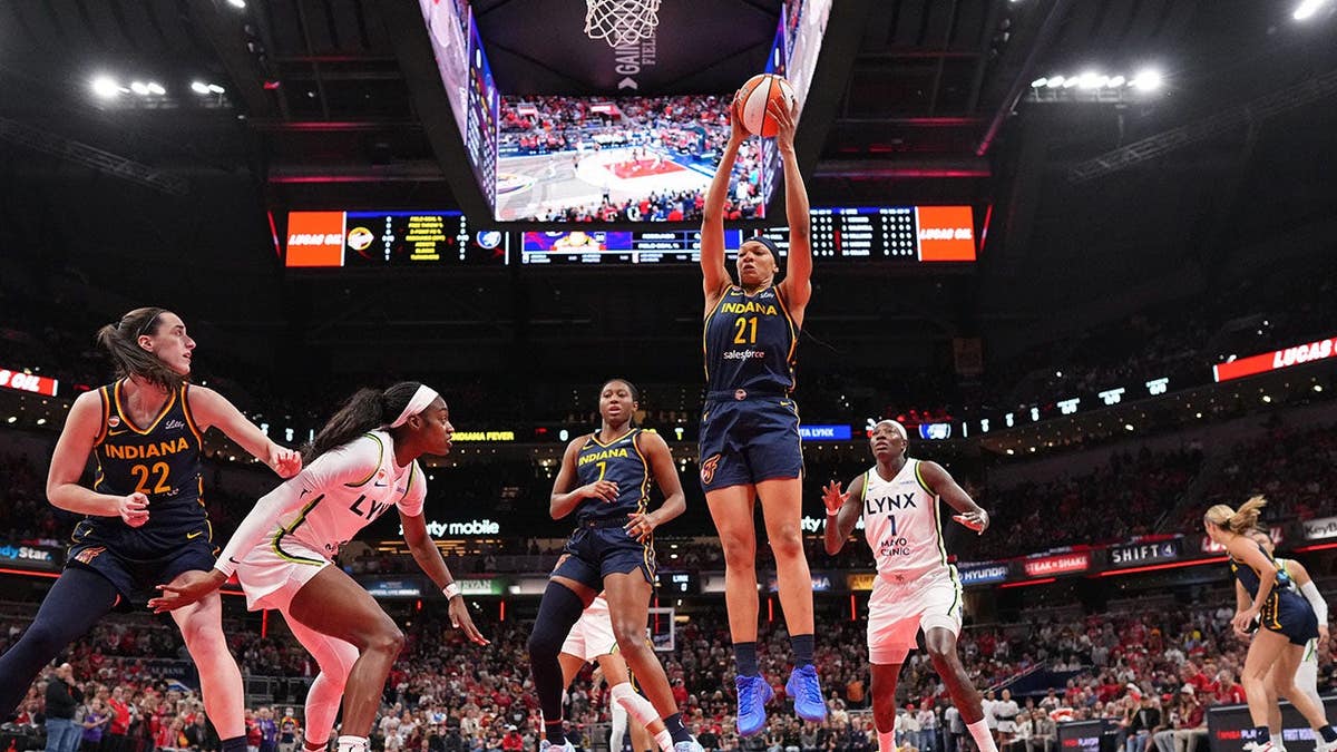 Makayla Timpson, No. 21, rebounds the ball during a WNBA game against the Minnesota Lynx.