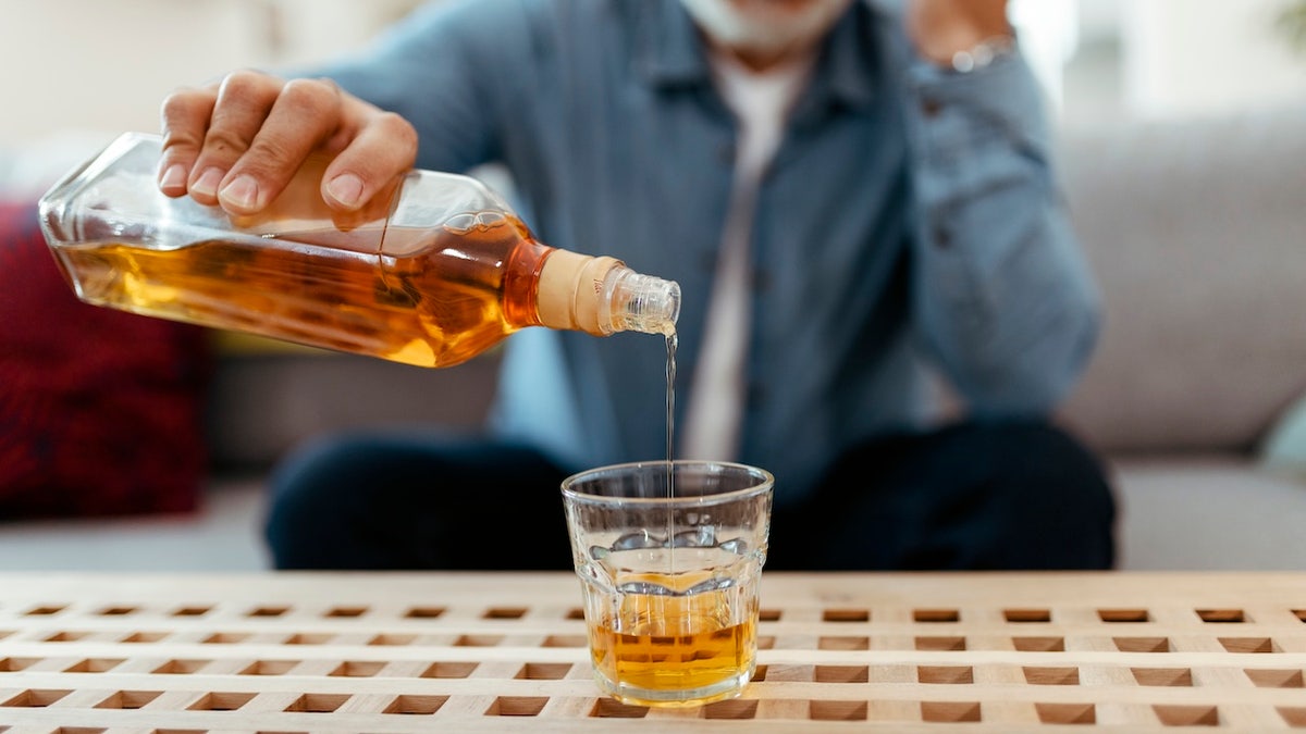 Man pouring liquor